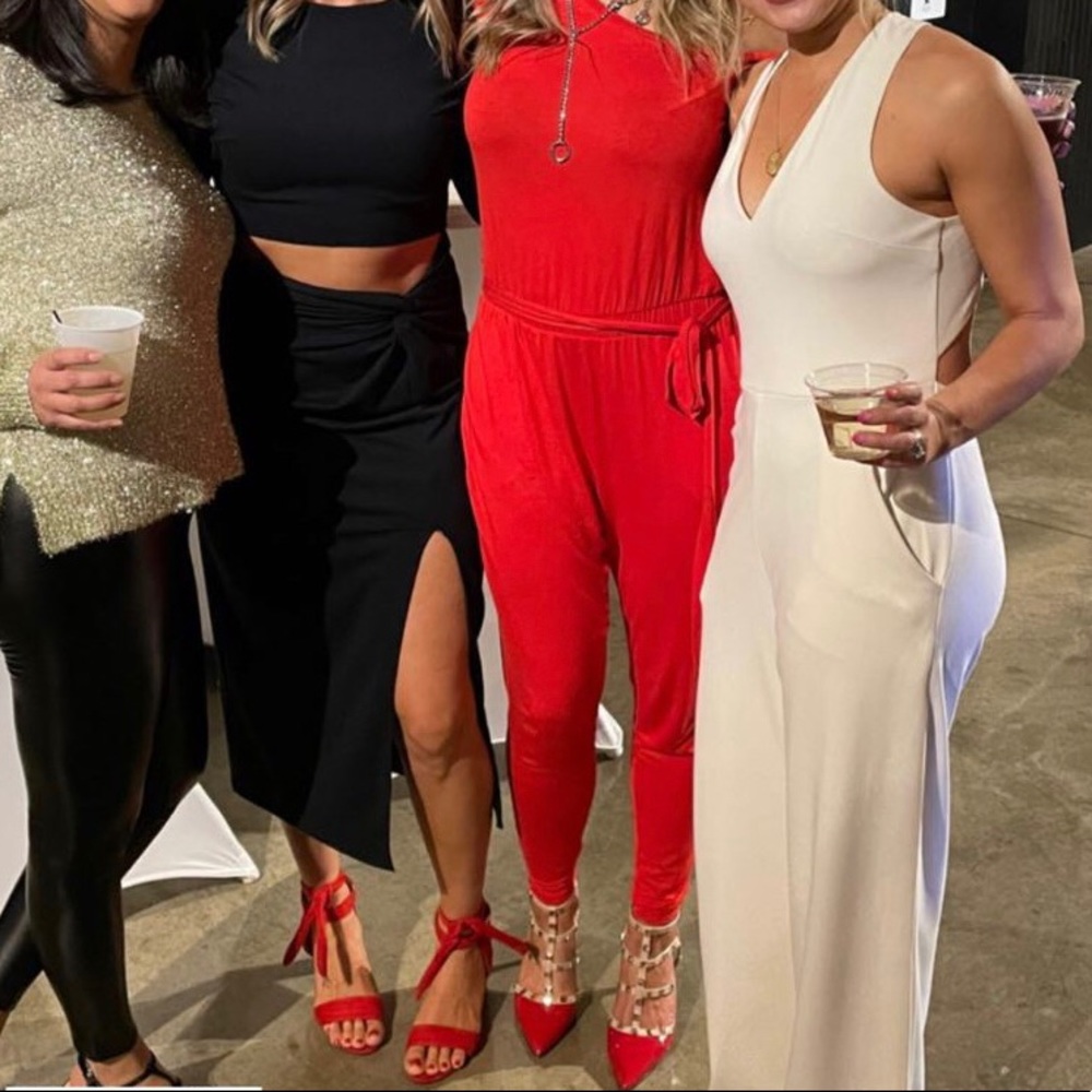 Red off-the-shoulder jumpsuit.